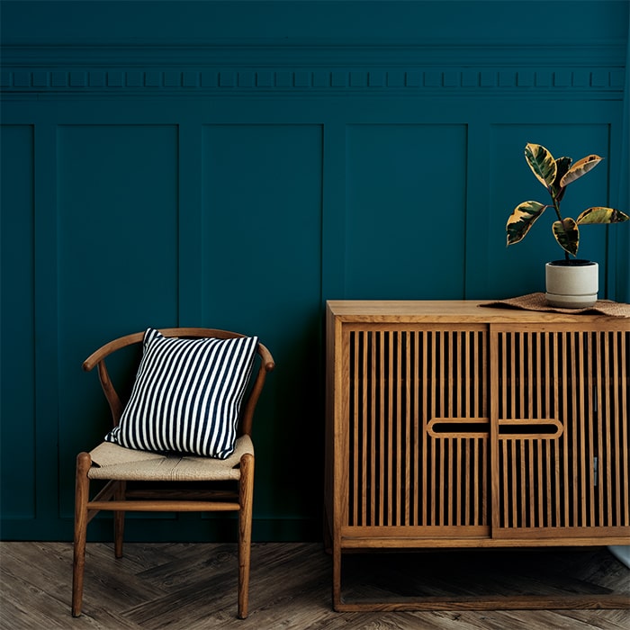 Untitled-1_0000_scandinavian-vintage-wood-cabinet-with-chair-by-dark-blue-wall-min